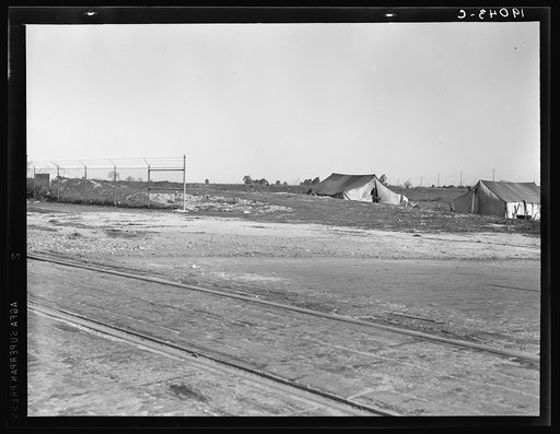 Untitled photo, possibly related to: Migrants' tents are a common sight along the right of way of the southern pacific. Near Fresno, California