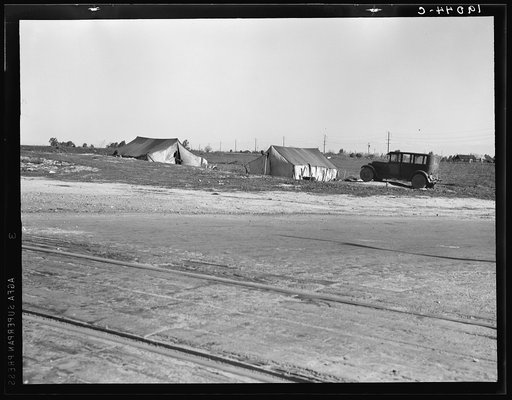 Migrants' tents are a common sight along the right of way of the southern pacific. Near Fresno, California