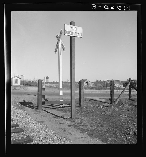 Near Fresno, California. Migrants' tents are a common sight along the right of way of the Southern Pacific