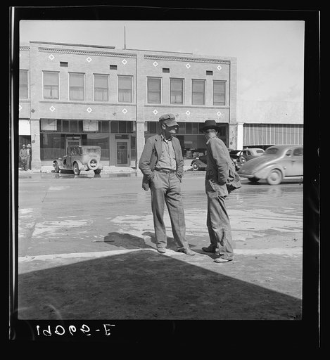 Untitled photo, possibly related to: Calipatria, Imperial Valley. Idle pea pickers discuss prospects for work. California