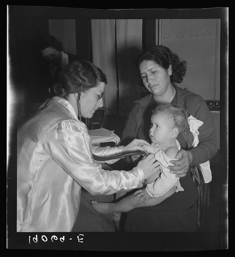 Calipatria, Imperial Valley. Visiting public health doctor conducts well-baby clinic in local school building adjacent to pea harvest. Many migratory mothers attend