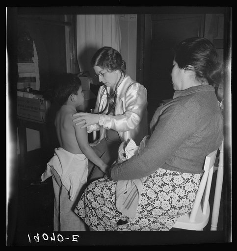 Calipatria, Imperial Valley. Visiting public health doctor conducts well-baby clinic in local school building adjacent to pea harvest. Many migratory mothers attend