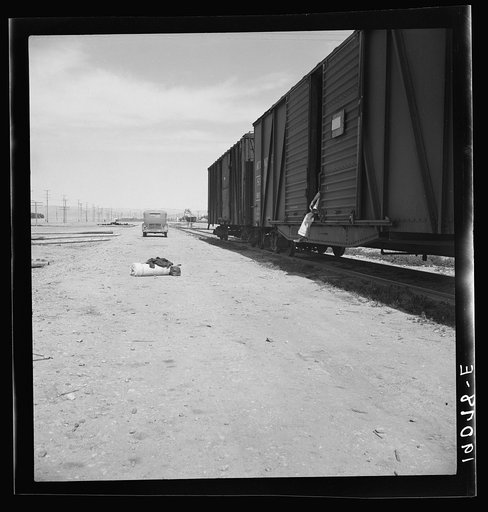 Untitled photo, possibly related to: Car on siding across tracks from pea packing plant. Twenty-five year old itinerant, originally from Oregon. "On the road eight years, all over the country, every state in the union, back and forth, pick up a job here and there, travelling all the time." Calipatri