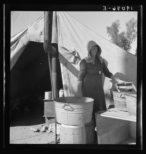Untitled photo, possibly related to: Texas woman in carrot pullers' camp. Imperial Valley, California. This sunbonnet is typical of women who came from Texas