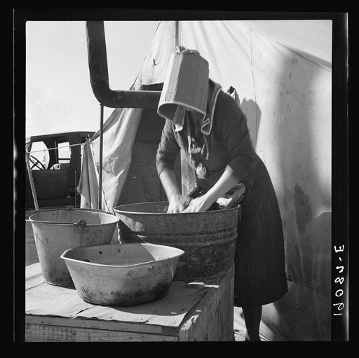 Untitled photo, possibly related to: Texas woman in carrot pullers' camp. Imperial Valley, California. This sunbonnet is typical of women who came from Texas