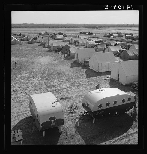 Farm Security Administration (FSA) migratory labor camp (emergency). This camp was established for the spring pea harvest. 155 families were living on the site two weeks after the camp was opened. Photograph shows two trailers recently purchased. One to be used as living quarters, office and headqua