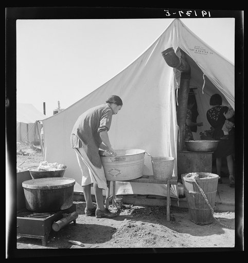 Untitled photo, possibly related to: Pea picker camp. This family had been farm owners in Oklahoma, lost their farm and for the last three years "have been draggin' our children around California. We're a have-to case." Calipatria, Imperial Valley, California