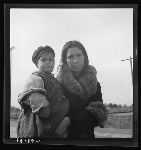 Untitled photo, possibly related to: On U.S. 99. Near Brawley, Imperial County. Homeless mother and youngest child of seven walking the highway from Phoenix, Arizona where they picked cotton. Bound for San Diego, where the father hopes to get on relief "because he once lived there."