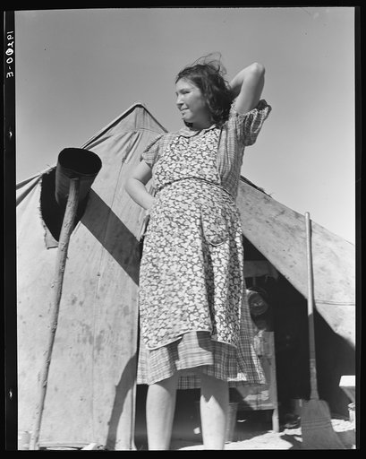 Untitled photo, possibly related to: Near Calipatria, Imperial Valley, California. In grower's camp for migrant labor on the edge of the pea fields. Public health nurse interviews and advises prospective mother, aged seventeen, before arrival of first baby. Husband, aged twenty-three, is out picking