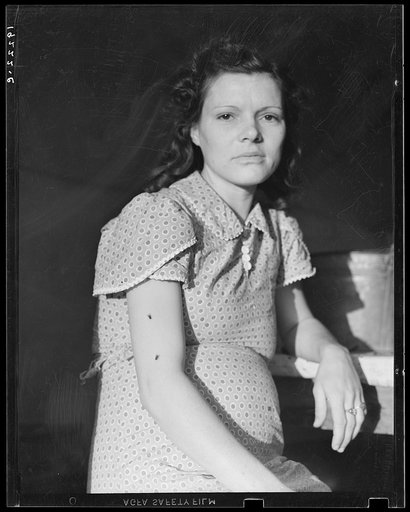 Daughter of migratory family in Farm Security Administration (FSA) labor camp. Calpatria, Imperial Valley, California