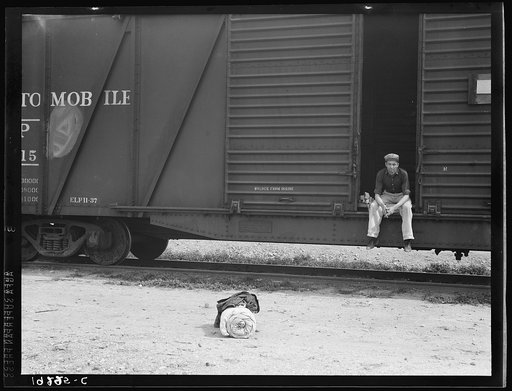 Car on siding across tracks from pea packing plant. Twenty-five year old itinerant, originally from Oregon. "On the road eight years, all over the country, every state in the union, back and forth, pick up a job here and there, travelling all the time." Calipatria, Imperial Valley