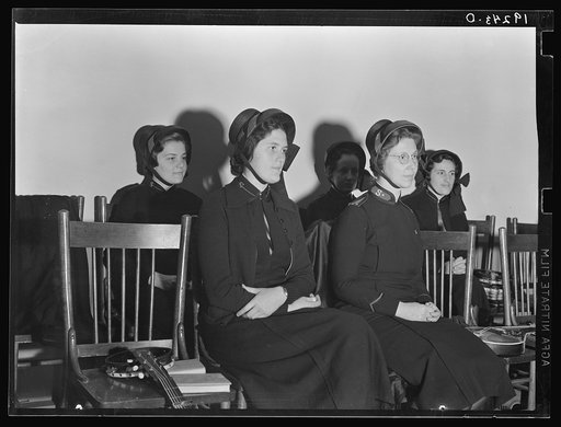 Visiting lassies sit on rostrom. Salvation Army, San Francisco, California