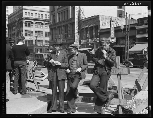 Salvation Army, San Francisco, California. Unemployed young men pause a moment to loiter and watch, and then pass on