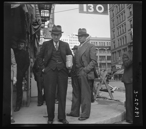 Salvation Army, San Francisco, California. Men pause a moment to watch, and then pass on