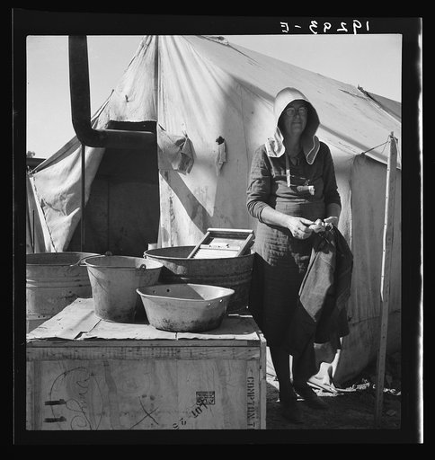 Texas woman in carrot pullers' camp. Imperial Valley, California. This sunbonnet is typical of women who came from Texas