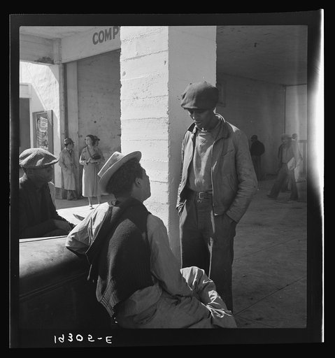 Outside the Farm Security Administration (FSA) grant office during the pea harvest. Calipatria, California. During spring of 1938 for the first time, the labor surplus had grown so large that relief grants were necessary even during the peak of harvest. Colored migrants are becoming more numerous th