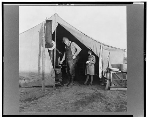 Supper time in Farm Security Administration (FSA) migratory emergency camp for workers in the pea fields. Calipatria, California