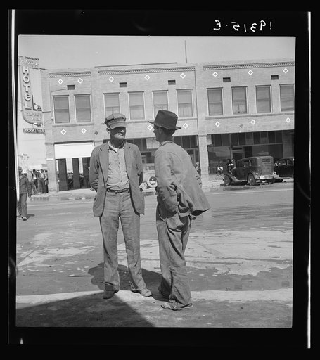 Untitled photo, possibly related to: Calipatria, Imperial Valley. Idle pea pickers discuss prospects for work. California