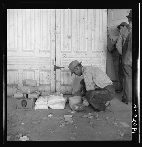 Outside the Farm Security Administration (FSA) grant office during pea harvest. Calipatria, California. During the spring of 1938 for the first time the labor surplus has grown so large that relief grants were necessary even during the peak of harvest