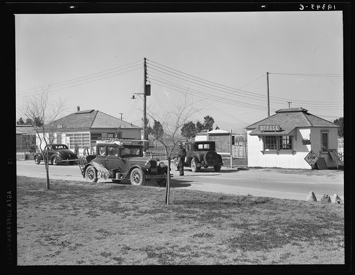 Entering Farm Security Administration (FSA) camp for migratory laborers at Indio. Coachella Valley, California