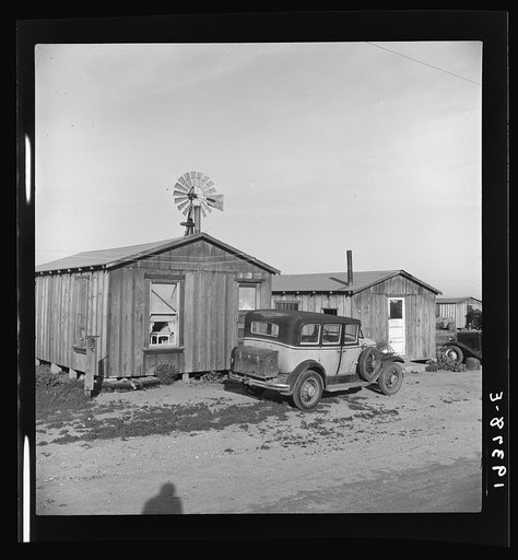 Untitled photo, possibly related to: Cabins which rent for ten dollars a month. Includes iron bed and electric lights. In Arkansawyers auto camp. Greenfield, Salinas Valley, California