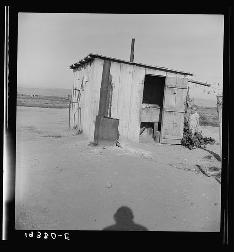 Untitled photo, possibly related to: Laundry facilities for ten cabins at Arkansawyers auto camp, Salinas Valley, California. Note stove to heat water