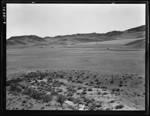 U.S. 99 on ridge over Tehachapi Mountains. Heavy truck route between Los Angeles and San Joaquin Valley over which migrants travel back and forth