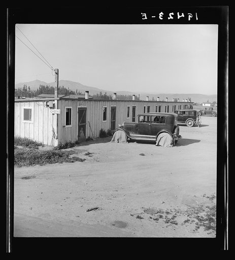 Arkansawyers auto camp. Ten cabins which rent for ten dollars a month with iron bed and electric light, one room. Greenfield, Salinas Valley, California