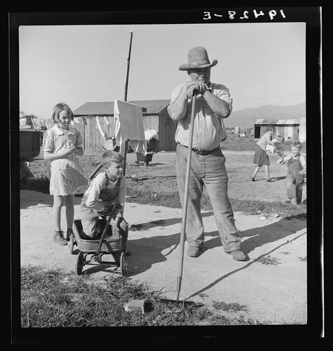Outskirts of Salinas, California. Rapidly growing settlement of lettuce workers. Family from Oklahoma settling in makeshift dwelling