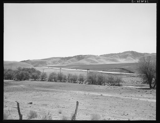 U.S. 99 on ridge over Tehachapi Mountains. Heavy truck route between Los Angeles and San Joaquin Valley, California, over which migrants travel back and forth