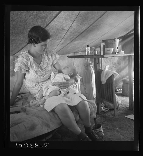 Young migrant mother with six weeks old baby born in a hospital with aid of Farm Security Administration (FSA) medical and association for migratory workers. She lives in a labor contractors camp near Westley, California. "I try to keep him eatin' and sleepin' regular like I got him out of the hospi