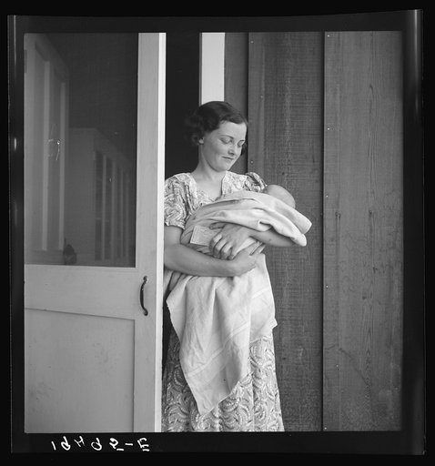 Farm Security Administration (FSA) migrant camp. Westley, California. This migrant mother lives in a contractor's camp because of contractor's control of jobs. She comes to the Farm Security Administration camp with sick baby and agricultural workers medical association card (FSA)