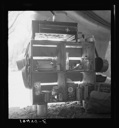 Tent interior in a labor contractor's camp, showing household equipment. Near Westley, California