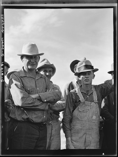 Untitled photo, possibly related to: Watching ball game. Shafter camp for migrants. California