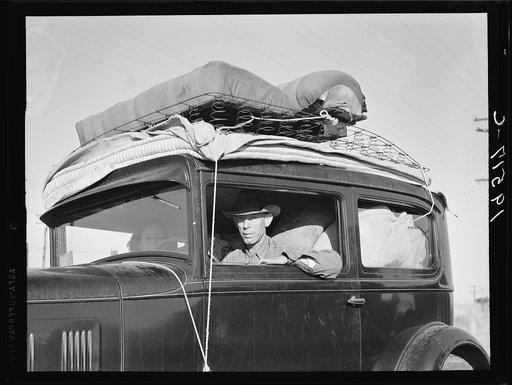 Migratory cotton picker from Kansas on highway near Merced, California