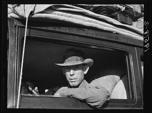 Merced (vicinity), California. Migratory cotton picker on highway near Merced, California. He and his family from Independence, Kansas, have been looking for work chopping cotton