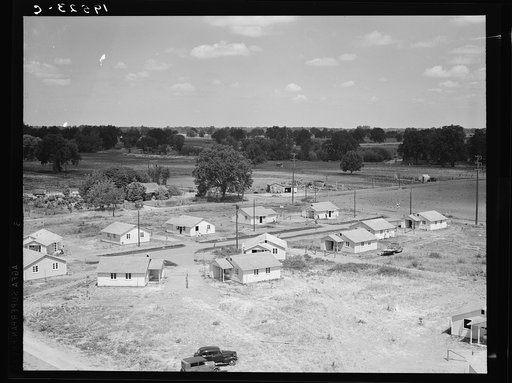 Untitled photo, possibly related to: Partially completed homes for agricultural workers to enable them to settle permanently. These houses rent for eight dollars and twenty cents per month which includes water and electricity. This tract adjoins the migratory labor camp. Farmersville, California. Co
