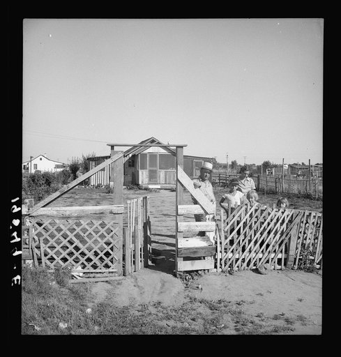 Highway City, California. Near Fresno. See General caption. Also 19553 for complete caption. Family from Oklahoma