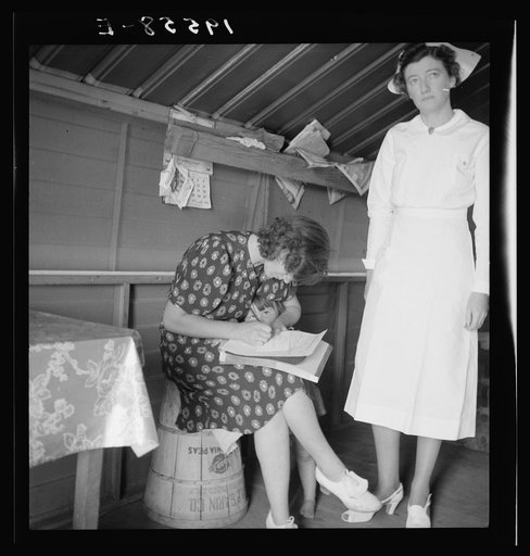 Untitled photo, possibly related to: Farm Security Administration (FSA) camp. Farmersville, California. Resident nurse interviews mother and examines sick baby