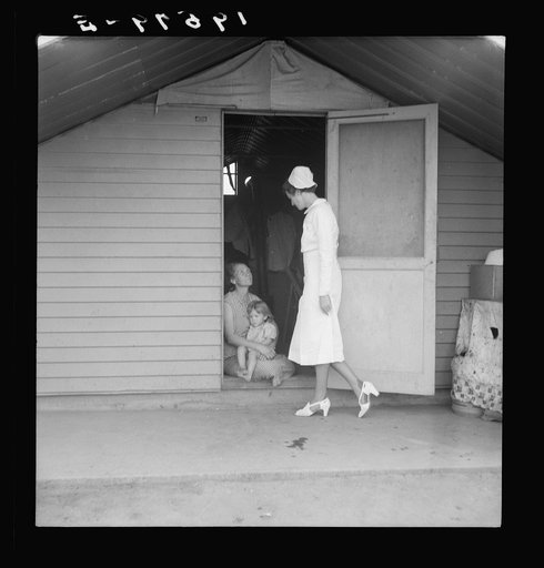 Farm Security Administration camp (FSA). Farmersville, Tulare County. Shows resident nurse come to visit family where there is sick baby