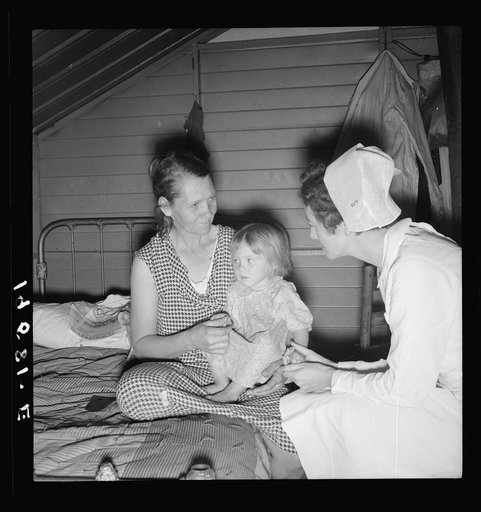 Farm Security Administration (FSA) camp. Farmersville, California. Resident nurse interviews mother and examines sick baby