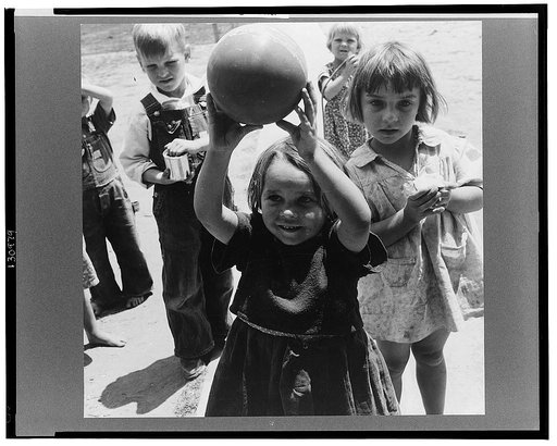 Tulare County. Farm Security Administration (FSA) camp for migrant agricultural workers. Nursery school, showing migrant children playing. California