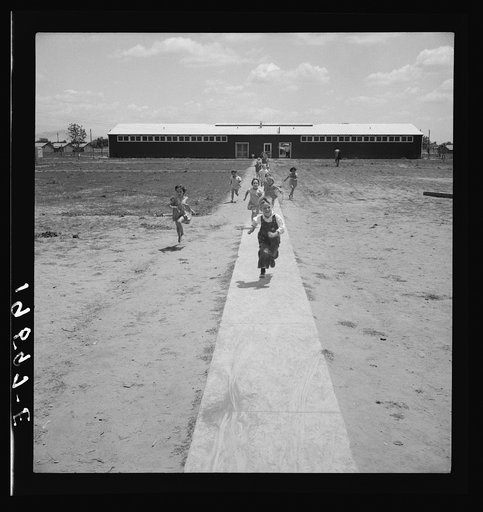 Untitled photo, possibly related to: Farm Security Administration (FSA) camp at Farmersville. Nursery school children showing community laundry building. California