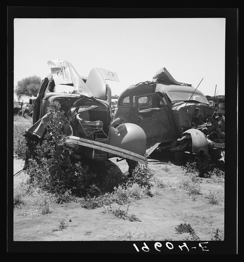 Near Tulare, California, U.S. 99. See general caption. Used car lots and auto wrecking establishments add to the litter which fronts this highway