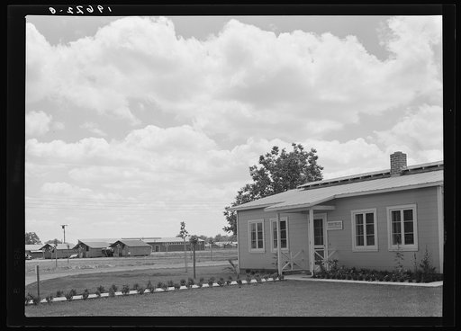 Tulare County, California. Farm Security Administration (FSA) camp for migratory agricultural workers. View of camp, showing clinic in foreground
