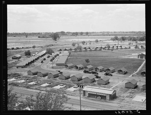 Untitled photo, possibly related to: Same as 19635. General view of one end of camp showing three units of the camp, each with its sanitary building. Farmersville, Tulare County, California