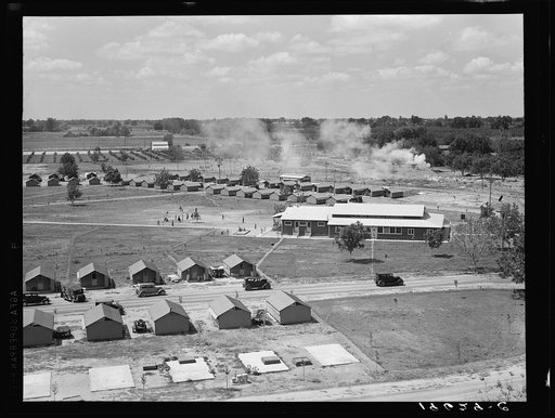 Tulare County, California. Farm Security Administration (FSA) camp for migratory workers at Farmersville. See 19635. General view of camp seen from water tower, showing community building and playground