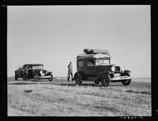 Untitled photo, possibly related to: Between Tulare and Fresno (see general caption). Two families originating from Independence, Kansas, on U.S. 99. Started out from Fresno that morning for work cotton chopping