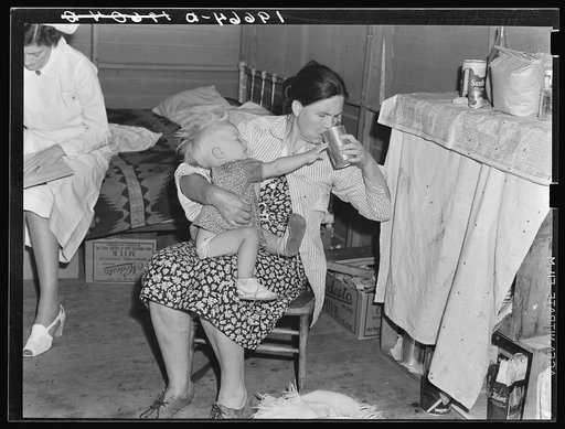 Tulare County, California. In Farm Security Administration (FSA) camp. Mother from Oklahoma tends baby with dysentery and awaits arrival of FSA camp resident nurse