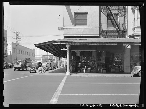 Fresno. Street corner of San Joaquin Valley town on U.S. 99 showing secondhand store. California